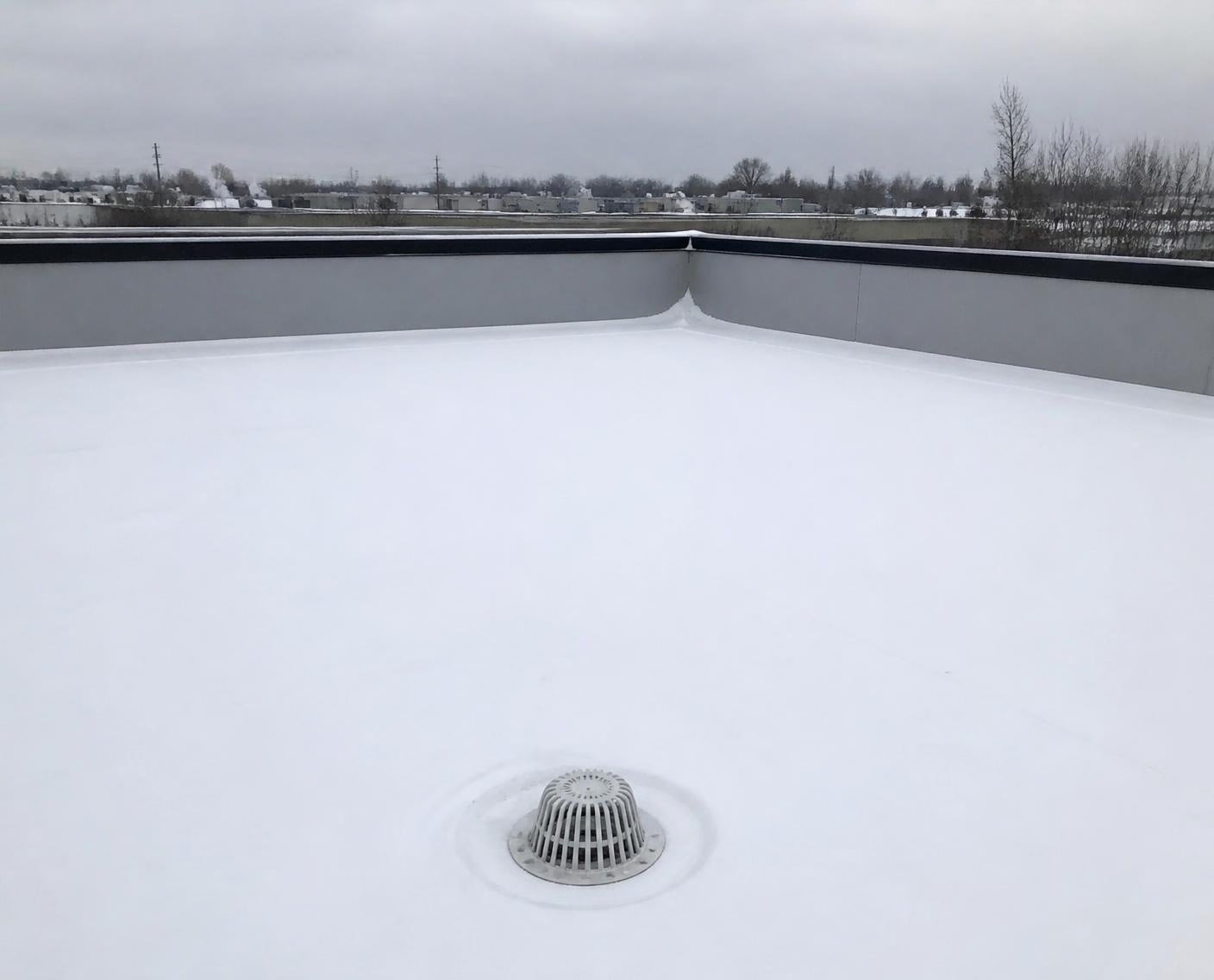 Finished coated roof with a clear drain after the first snow