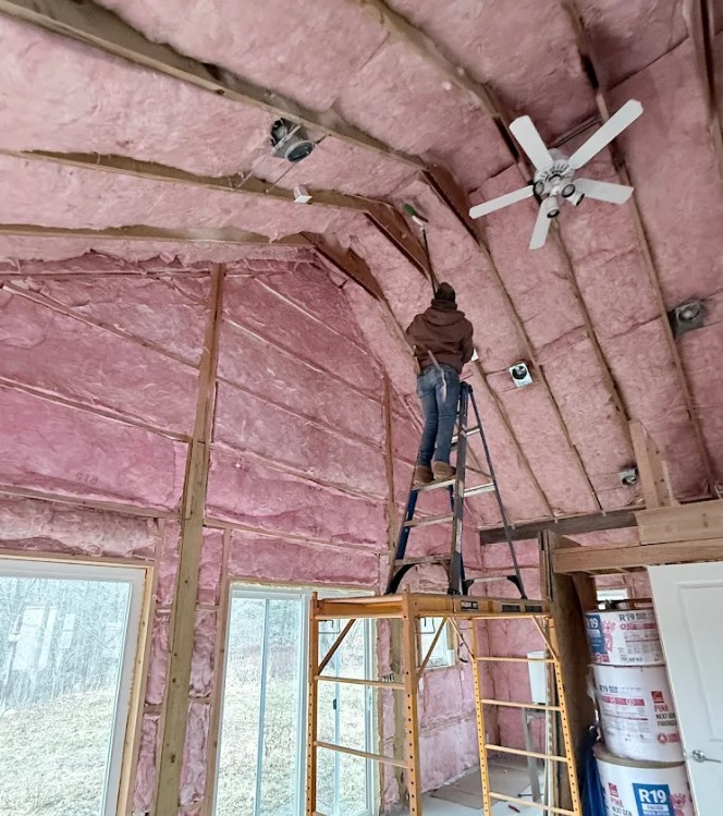 Fiberglass insulation batts with unfaced, kraft paper, and foil facings.